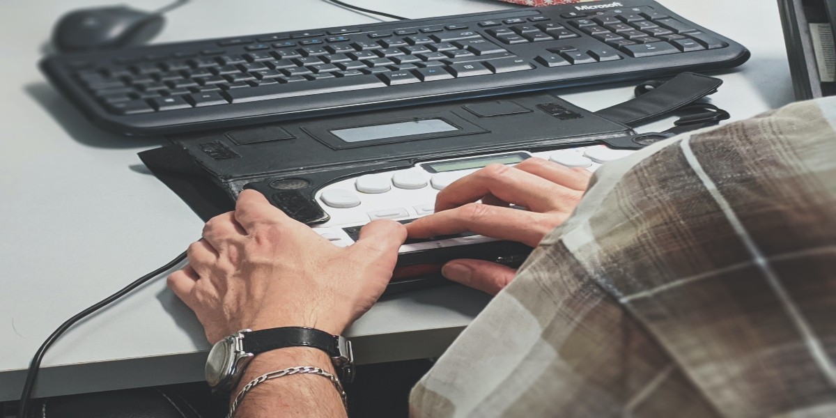 a man using a braille display